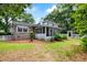Backyard featuring a screened-in porch and a white picket fence at 886 Friendly Cir, Charleston, SC 29414