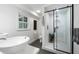 Contemporary bathroom features a sleek glass shower, floating vanity, and window at 886 Friendly Cir, Charleston, SC 29414