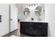 Bathroom vanity with dual vessel sinks, dark cabinets, and modern fixtures at 886 Friendly Cir, Charleston, SC 29414