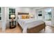 Cozy bedroom with a wooden bed frame, stylish lighting, and access to the backyard through glass doors at 886 Friendly Cir, Charleston, SC 29414