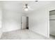 Bright bedroom featuring neutral carpet, a modern ceiling fan, and closet access at 886 Friendly Cir, Charleston, SC 29414