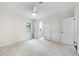 Spacious bedroom with a ceiling fan and view of en-suite bathroom at 886 Friendly Cir, Charleston, SC 29414