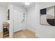 Bright entryway featuring a classic white door and modern decor, complemented by light wood floors at 886 Friendly Cir, Charleston, SC 29414