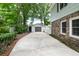 Property features a detached garage and additional storage with lush landscaping at 886 Friendly Cir, Charleston, SC 29414
