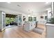 Modern kitchen featuring a large island and an easy transition to the outdoor screened porch for entertaining at 886 Friendly Cir, Charleston, SC 29414