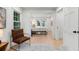 Comfortable seating area with a leather chair, light wood floors, and view of bedroom at 886 Friendly Cir, Charleston, SC 29414