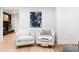 Bright living space with modern chairs, stylish art, and a cozy atmosphere near a unique fireplace feature at 886 Friendly Cir, Charleston, SC 29414