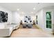 Inviting living room featuring white walls, light wood floors, and a comfortable seating arrangement at 886 Friendly Cir, Charleston, SC 29414