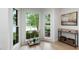 Bright and airy living room featuring large windows and views of the surrounding landscape at 886 Friendly Cir, Charleston, SC 29414