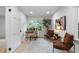 Bright home office with a desk, decorative tree, and comfortable chairs at 886 Friendly Cir, Charleston, SC 29414