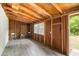 Shed featuring exposed framing and wooden floors with a window and open doorway at 886 Friendly Cir, Charleston, SC 29414
