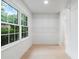 Spacious walk-in closet with built-in shelving and natural light at 886 Friendly Cir, Charleston, SC 29414