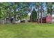 Expansive backyard showcasing a lush lawn and mature trees, offering ample space at 8967 N Red Maple Cir, Summerville, SC 29485
