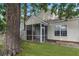 Backyard view of the screened in porch at 8967 N Red Maple Cir, Summerville, SC 29485