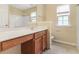 The bathroom has a wooden vanity, tub and shower at 8967 N Red Maple Cir, Summerville, SC 29485