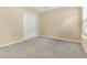 A neutral bedroom features a double door closet and a window at 8967 N Red Maple Cir, Summerville, SC 29485