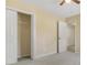 This is a bedroom with 2 doors, carpet and tan walls at 8967 N Red Maple Cir, Summerville, SC 29485