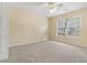 This bedroom has carpet, tan walls and a ceiling fan at 8967 N Red Maple Cir, Summerville, SC 29485