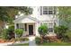 Two-story home featuring black shutters, manicured bushes, and a well-maintained lawn with mature trees at 8967 N Red Maple Cir, Summerville, SC 29485