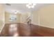 Bright living room featuring wood floors, recessed lighting, and neutral paint with stairs to upper floor at 8967 N Red Maple Cir, Summerville, SC 29485