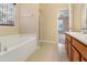The bright main bathroom features a large soaking tub and a vanity with generous countertop space at 8967 N Red Maple Cir, Summerville, SC 29485