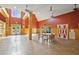 Spacious meeting room with vaulted ceiling, rustic wood accents, and ample natural light at 8967 N Red Maple Cir, Summerville, SC 29485