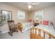 Cozy bedroom featuring two twin beds, a rocking chair, and windows with natural light at 930 Stiles Dr, Charleston, SC 29412