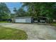 Detached garage with covered parking spaces on large concrete driveway at 930 Stiles Dr, Charleston, SC 29412