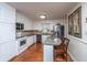Bright kitchen boasts white cabinetry, granite countertops, and stainless steel appliances at 930 Stiles Dr, Charleston, SC 29412