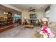 Open living area with a leather sofa, ceiling fan, and a glimpse into the dining area at 930 Stiles Dr, Charleston, SC 29412