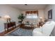 Bright living room featuring hardwood floors, traditional furniture, and a large window at 930 Stiles Dr, Charleston, SC 29412