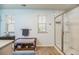 This is a full bathroom with a shower, modern lighting, and light wood flooring at 9711 Fanning Basket Ln, Ladson, SC 29456