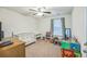 Bedroom with a white crib, changing table, and colorful toys at 9711 Fanning Basket Ln, Ladson, SC 29456