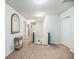 This is a hallway with carpet, white walls, and blue railing supports at 9711 Fanning Basket Ln, Ladson, SC 29456