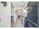 Inviting home entrance with a view into the dining area, showcasing wood-look floors at 9711 Fanning Basket Ln, Ladson, SC 29456