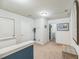 This is a hallway with a laundry room with white walls and carpet at 9711 Fanning Basket Ln, Ladson, SC 29456