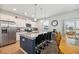 Modern kitchen with a granite island, stainless steel appliances, and bar stool seating at 9711 Fanning Basket Ln, Ladson, SC 29456
