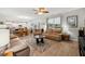 Spacious living room with an open layout connecting to a dining and kitchen area at 9711 Fanning Basket Ln, Ladson, SC 29456