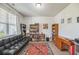 Cozy office space with a comfortable futon, bookshelves, and a functional desk setup at 9711 Fanning Basket Ln, Ladson, SC 29456