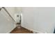 An interior image of a wooden staircase with white walls at 9711 Fanning Basket Ln, Ladson, SC 29456