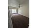 Bedroom with carpeted floor, ceiling fan, a window allowing natural light, and a standard door at 100 Lexington Pl, Goose Creek, SC 29445