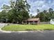 Exterior view of house with a large front yard and mature trees at 100 Lexington Pl, Goose Creek, SC 29445