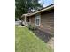 Charming single-story home with well-maintained lawn, beautiful landscaping, and inviting front porch at 100 Lexington Pl, Goose Creek, SC 29445