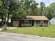 Charming single-story home with a well-manicured lawn and attached garage at 100 Lexington Pl, Goose Creek, SC 29445