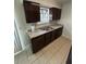 Well-lit kitchen with stainless steel sink and tile flooring at 100 Lexington Pl, Goose Creek, SC 29445