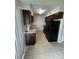 Efficient kitchen layout with black appliances and dark cabinetry at 100 Lexington Pl, Goose Creek, SC 29445