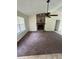 Cozy living room with a stone fireplace and a ceiling fan at 100 Lexington Pl, Goose Creek, SC 29445