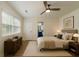 Well lit bedroom featuring a ceiling fan, neutral colors, and ensuite bathroom access at 103 Four Iron Dr, Summerville, SC 29483