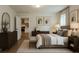 Stylishly staged bedroom with neutral tones, modern furnishings, and ample natural light at 103 Four Iron Dr, Summerville, SC 29483