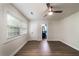 Well lit bedroom featuring a ceiling fan, wood flooring, and ensuite bathroom access at 103 Four Iron Dr, Summerville, SC 29483